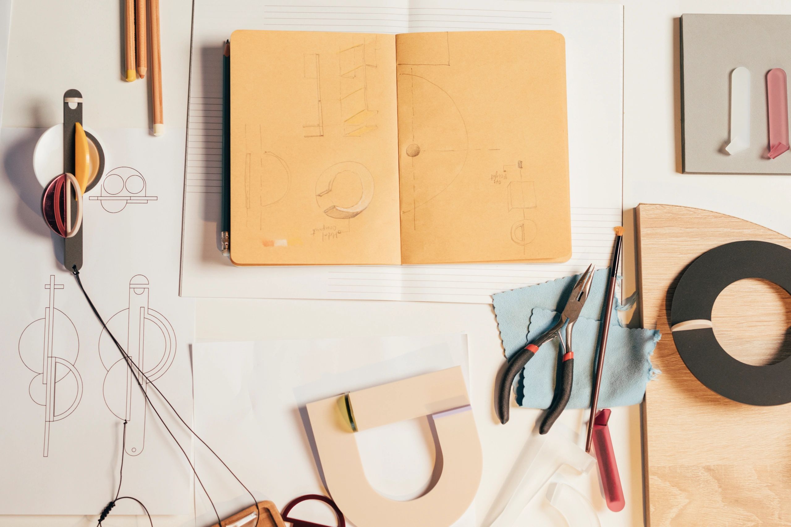 Overhead view of a maker workspace with tools and materials